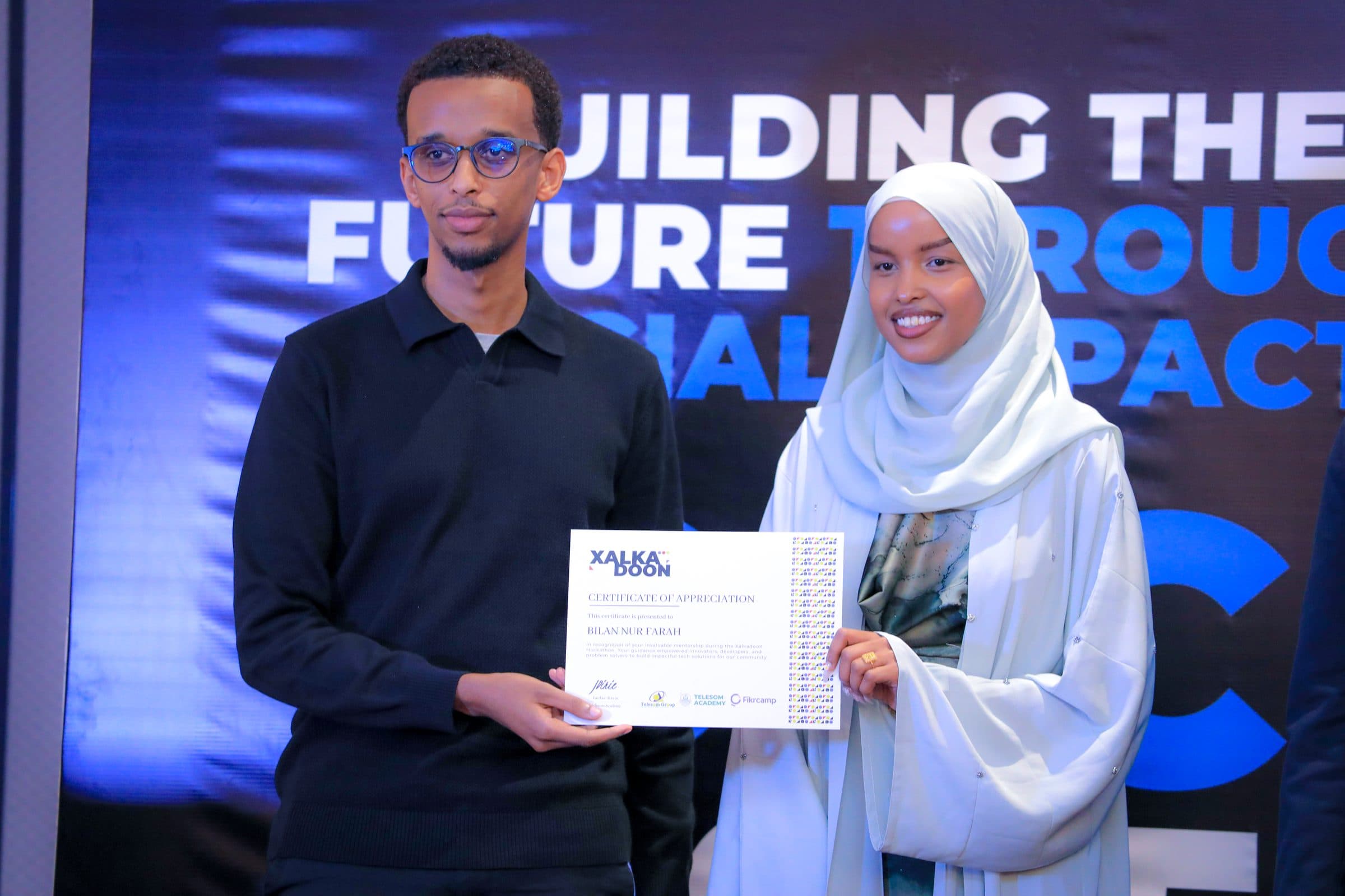 Bilan receiving a certificate of appreciation at Xalkadoon 2025